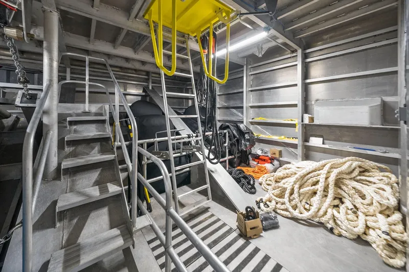 Shine Down Yacht Photos Pics Interior of 2025 Breaux Brothers 120 GLV boat, featuring ropes and equipment storage.