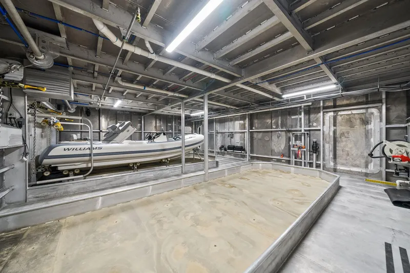 Shine Down Yacht Photos Pics Interior of a 2025 Breaux Brothers 120 GLV yacht with a stored inflatable boat.