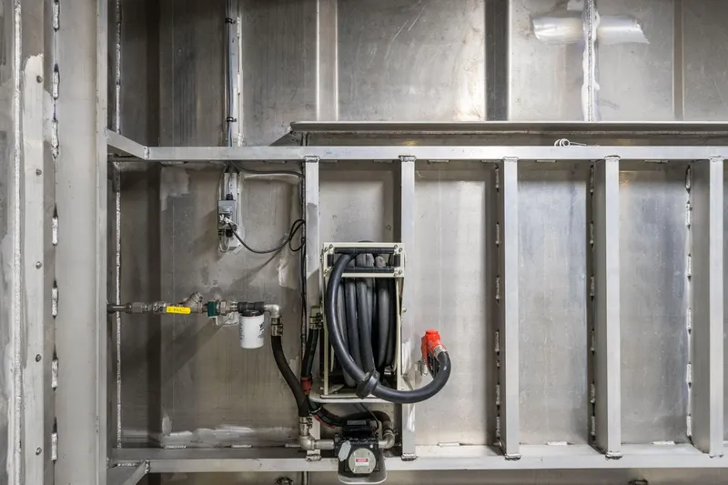 Shine Down Yacht Photos Pics Interior view of Breaux Brothers 120 GLV 2025, showcasing industrial piping and wiring.