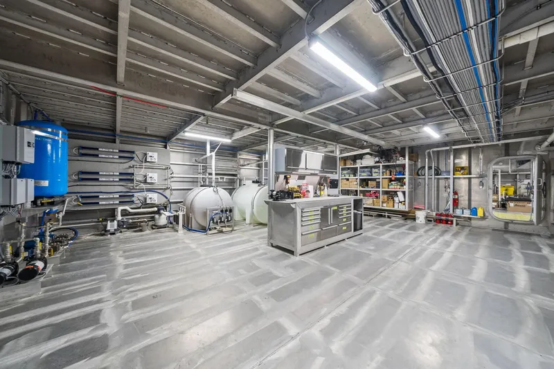 Shine Down Yacht Photos Pics Industrial interior of Breaux Brothers 120 GLV, 2025 model, featuring equipment and storage.