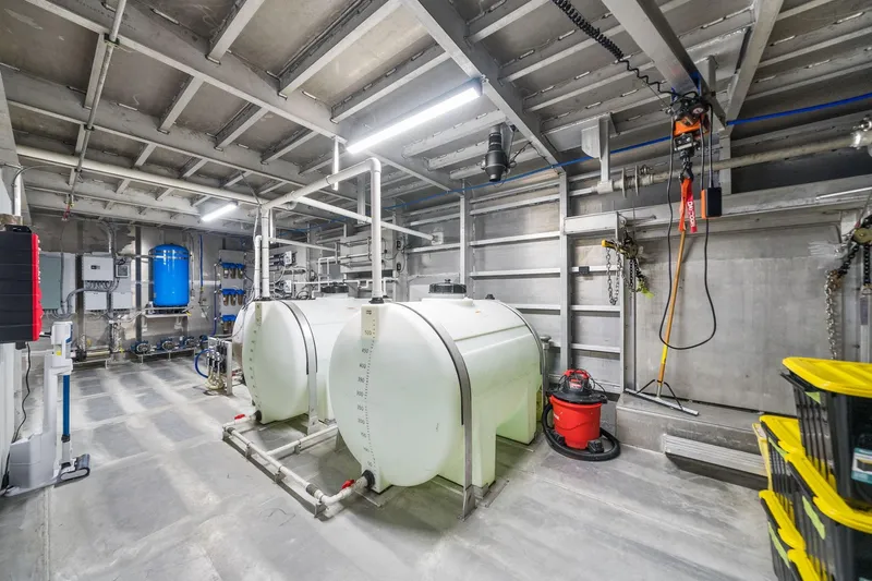 Shine Down Yacht Photos Pics Interior of a 2025 Breaux Brothers 120 GLV vessel, showcasing industrial equipment and storage tanks.