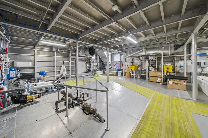 Shine Down Yacht Photos Pics Engine room of 2025 Breaux Brothers 120 GLV vessel, showcasing machinery and equipment.