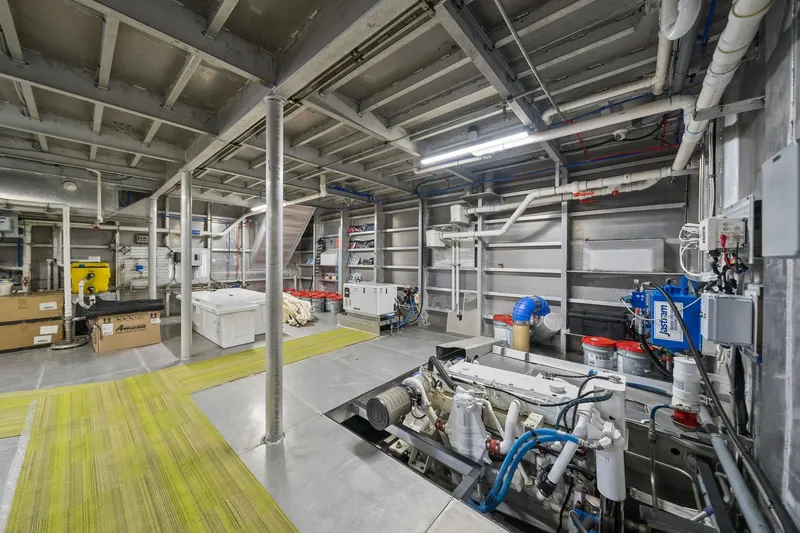 Shine Down Yacht Photos Pics Engine room of 2025 Breaux Brothers 120 GLV vessel, showcasing machinery and equipment.