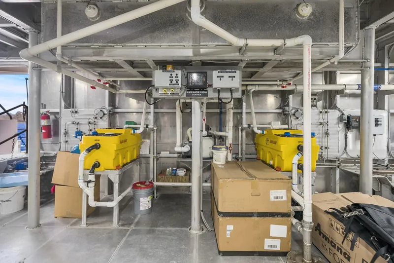 Shine Down Yacht Photos Pics Interior of Breaux Brothers 120 GLV 2025 model, featuring industrial equipment and storage boxes.