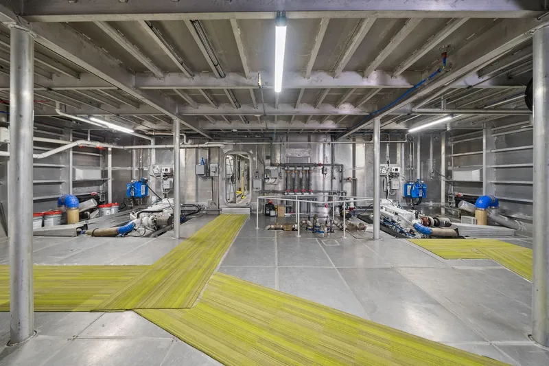 Shine Down Yacht Photos Pics Industrial interior of Breaux Brothers 120 GLV vessel, 2025 model, featuring pipes and machinery.