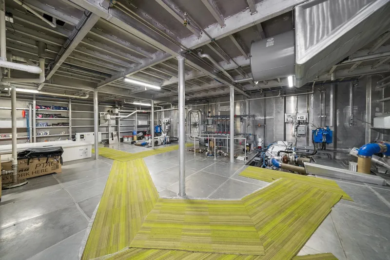 Shine Down Yacht Photos Pics Industrial interior of Breaux Brothers 120 GLV, 2025 model, showcasing machinery and piping.