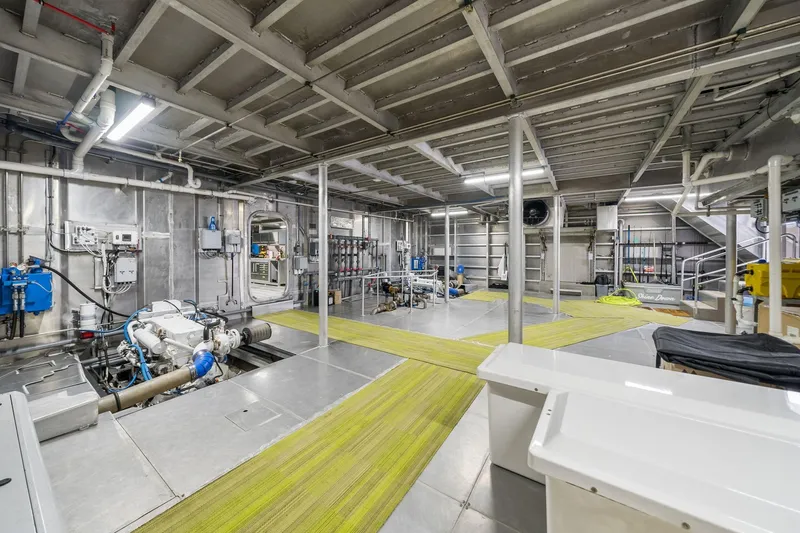 Shine Down Yacht Photos Pics Engine room of 2025 Breaux Brothers 120 GLV vessel, showcasing machinery and equipment.