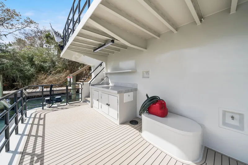 Shine Down Yacht Photos Pics Deck area of 2025 Breaux Brothers 120 GLV boat with sink and storage.