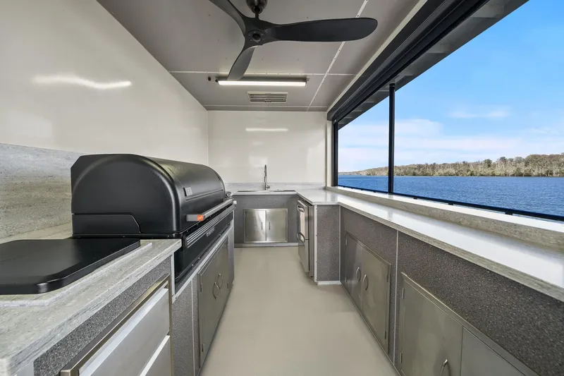 Shine Down Yacht Photos Pics Modern kitchen on Breaux Brothers 120 GLV yacht, 2025 model, with lake view.