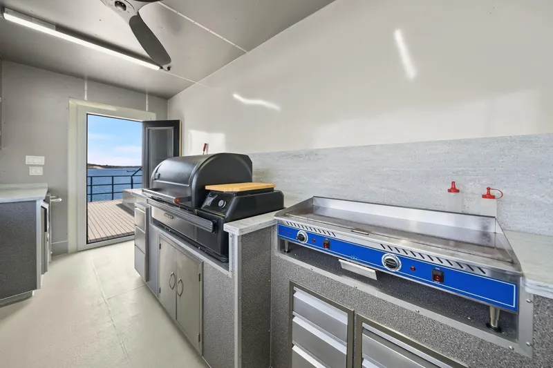 Shine Down Yacht Photos Pics Modern kitchen on Breaux Brothers 120 GLV yacht, featuring grill and ocean view, 2025 model.