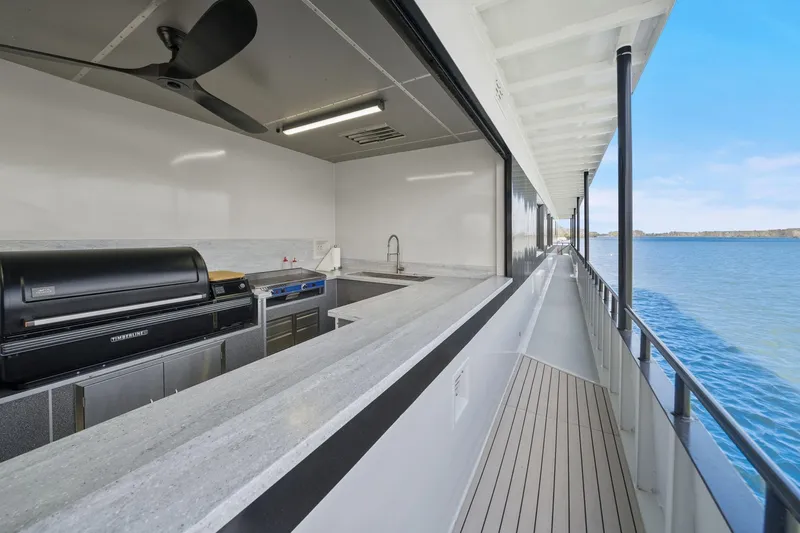 Shine Down Yacht Photos Pics Modern kitchen on Breaux Brothers 120 GLV yacht, 2025 model, with ocean view.