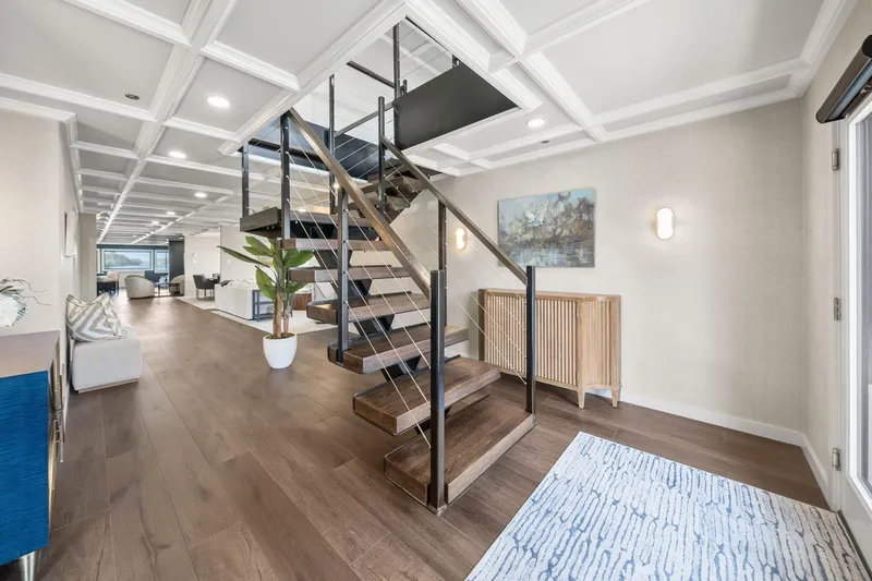 Shine Down Yacht Photos Pics Modern interior of Breaux Brothers 120 GLV yacht, featuring sleek staircase and elegant decor, 2025 model.