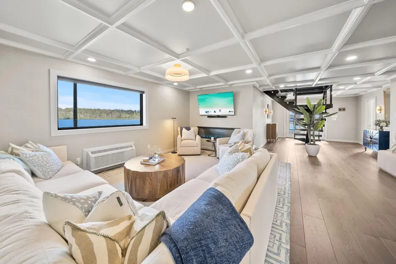 Shine Down Yacht Photos Pics Luxurious interior of 2025 Breaux Brothers 120 GLV yacht with modern decor and lake view.