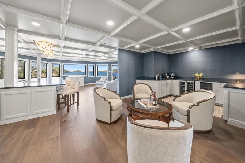 Shine Down Yacht Photos Pics Luxurious yacht interior with elegant seating, modern kitchen, and scenic windows on Breaux Brothers 120 GLV.