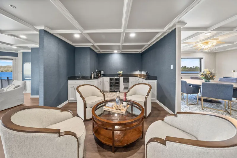 Shine Down Yacht Photos Pics Luxurious interior of 2025 Breaux Brothers 120 GLV yacht with elegant seating and kitchenette.