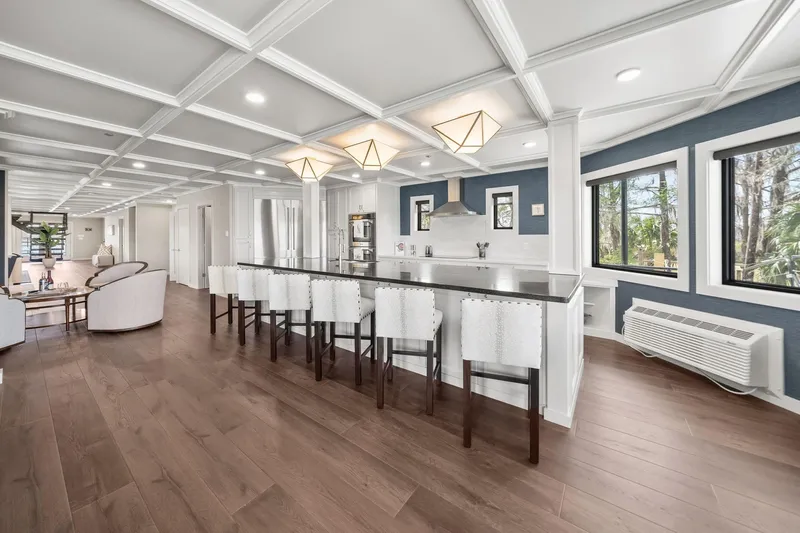 Shine Down Yacht Photos Pics Luxurious modern kitchen in Breaux Brothers 120 GLV, 2025 model, featuring sleek design and ample seating.