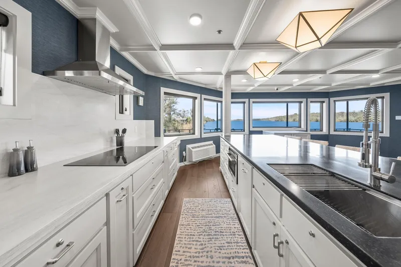 Shine Down Yacht Photos Pics Luxurious kitchen interior on Breaux Brothers 120 GLV yacht, featuring modern design and scenic views.