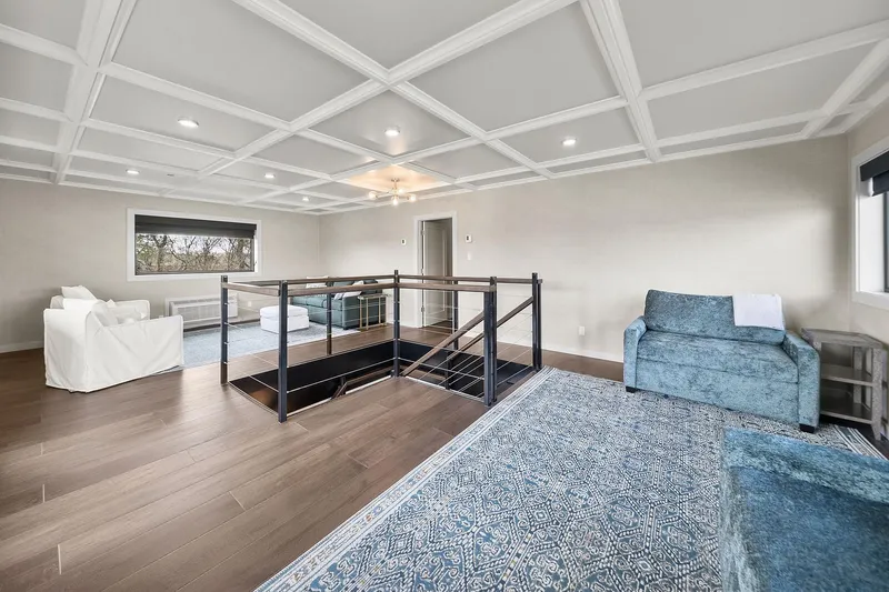 Shine Down Yacht Photos Pics Modern living room with coffered ceiling, hardwood floors, and stylish furniture, 2025 Breaux Brothers 120 GLV.