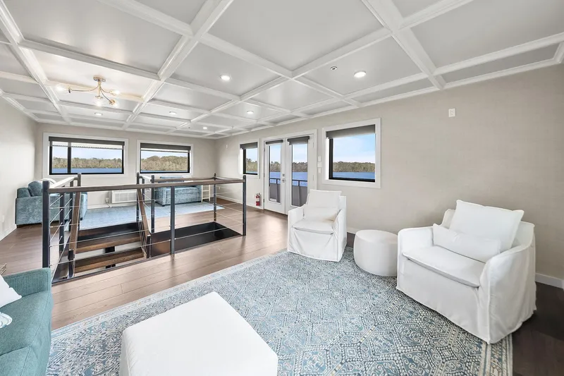 Shine Down Yacht Photos Pics Luxurious interior of 2025 Breaux Brothers 120 GLV yacht with modern seating and scenic views.