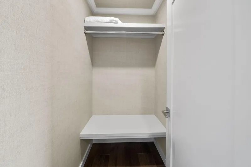 Shine Down Yacht Photos Pics Compact closet space with shelves in a Breaux Brothers 120 GLV, 2025 model.