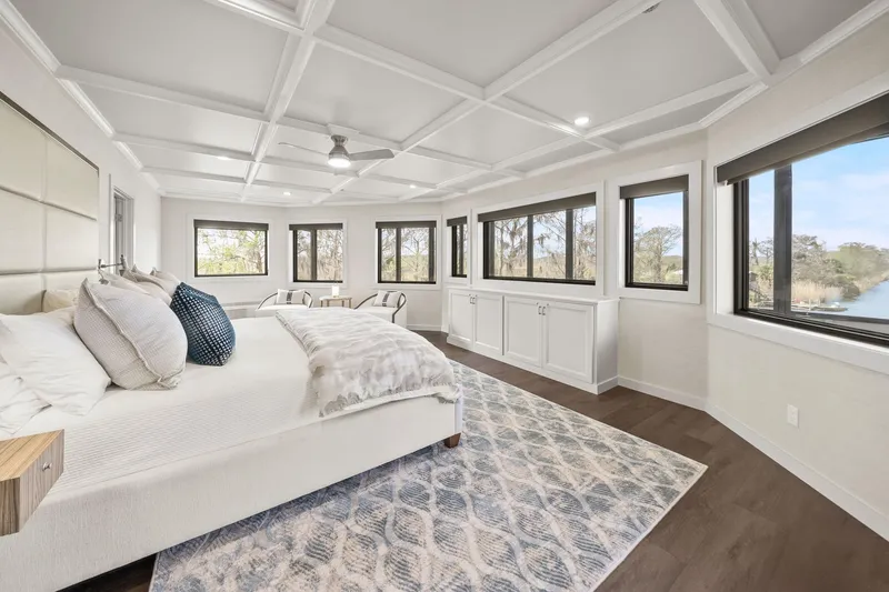 Shine Down Yacht Photos Pics Luxurious bedroom with large windows, modern decor, and scenic views on a 2025 Breaux Brothers 120 GLV.