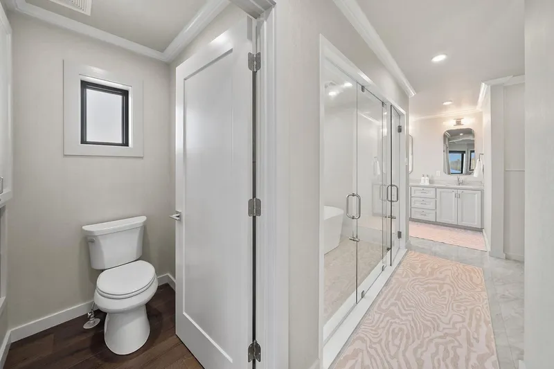 Shine Down Yacht Photos Pics Modern bathroom interior on Breaux Brothers 120 GLV yacht, featuring sleek design and elegant fixtures.