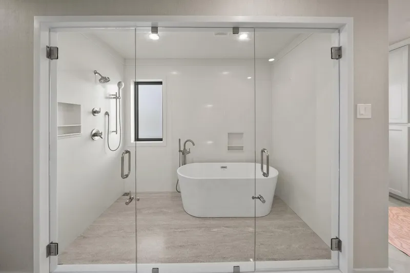 Shine Down Yacht Photos Pics Modern bathroom with glass shower, freestanding tub, and sleek fixtures, Breaux Brothers 120 GLV 2025.