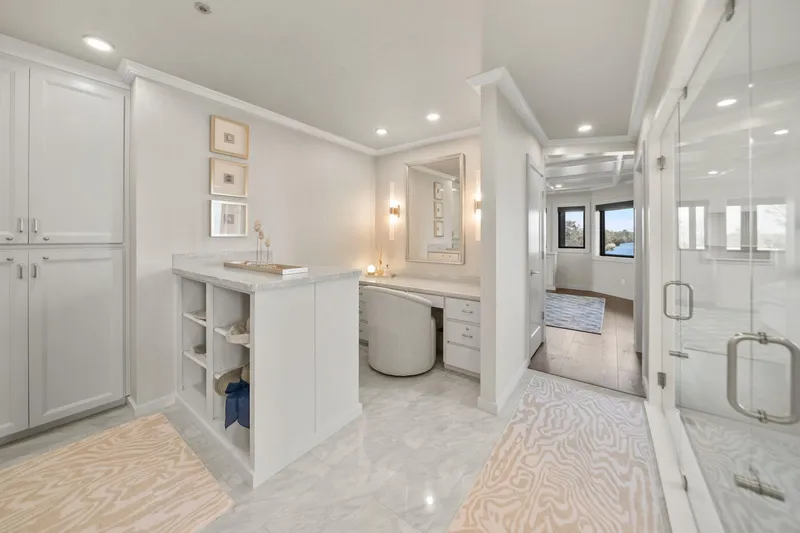 Shine Down Yacht Photos Pics Luxurious modern bathroom with elegant white cabinetry and marble flooring, Breaux Brothers 120 GLV 2025.
