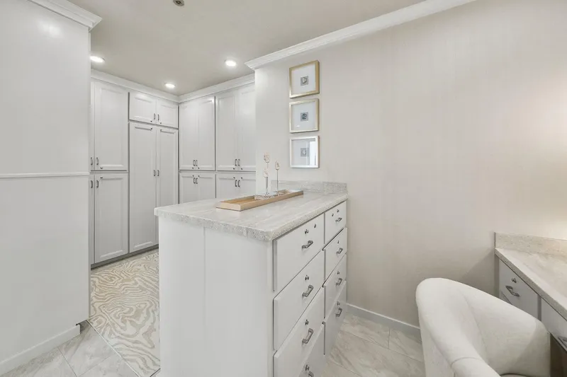 Shine Down Yacht Photos Pics Luxurious white closet interior with modern cabinetry, Breaux Brothers 120 GLV 2025 design.