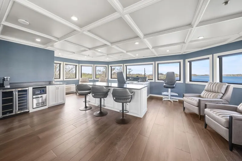 Shine Down Yacht Photos Pics Luxurious interior of 2025 Breaux Brothers 120 GLV yacht with panoramic windows and modern furnishings.