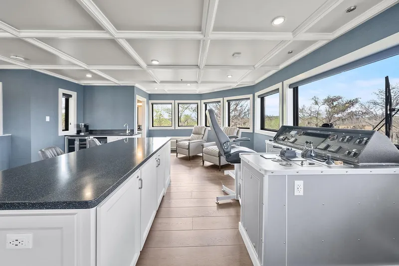 Shine Down Yacht Photos Pics Luxurious interior of 2025 Breaux Brothers 120 GLV with modern helm and panoramic windows.