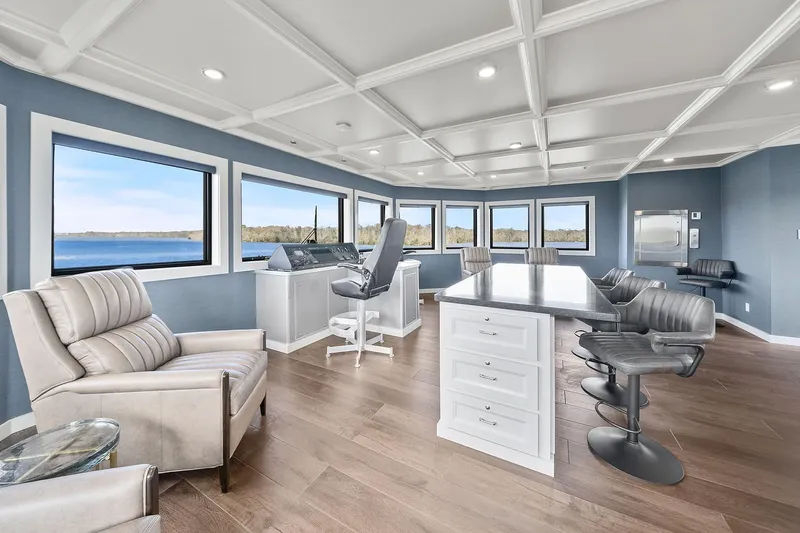 Shine Down Yacht Photos Pics Luxurious interior of 2025 Breaux Brothers 120 GLV yacht with panoramic windows and modern furnishings.