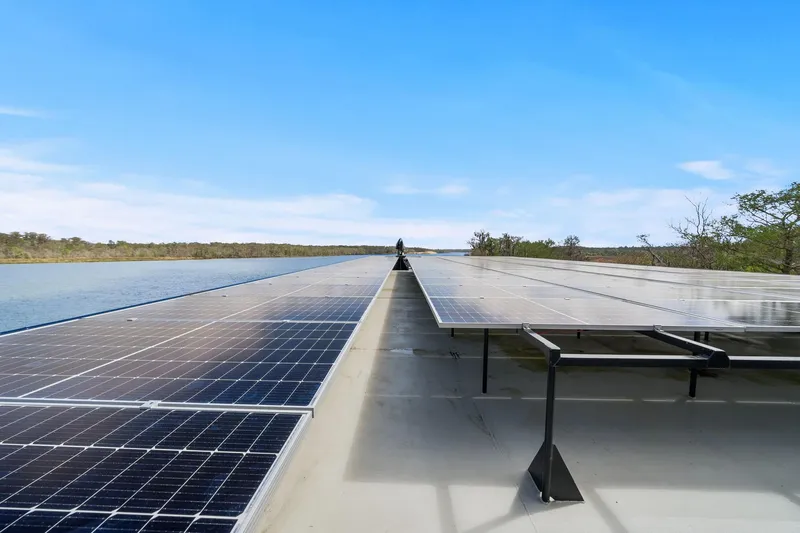 Shine Down Yacht Photos Pics Solar panels on Breaux Brothers 120 GLV boat, 2025 model, cruising on a serene river.