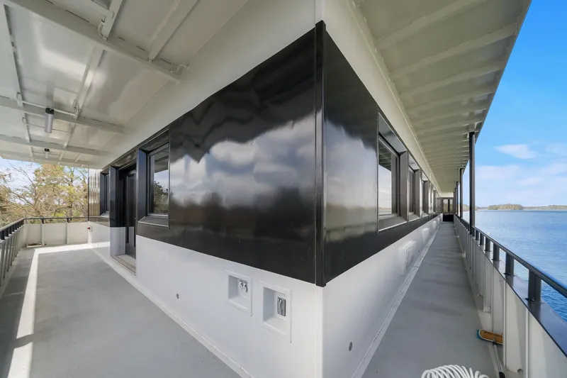 Shine Down Yacht Photos Pics Exterior view of 2025 Breaux Brothers 120 GLV yacht with sleek black and white design.