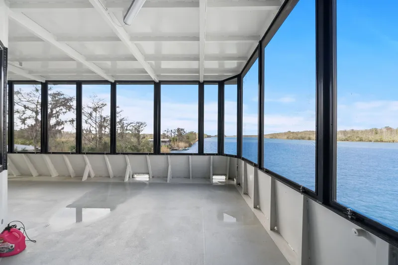 Shine Down Yacht Photos Pics Spacious interior of 2025 Breaux Brothers 120 GLV boat with panoramic river views.