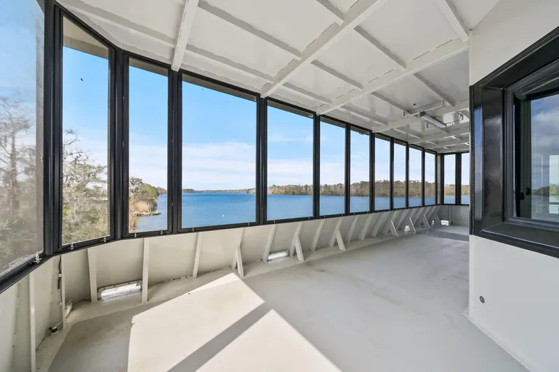 Shine Down Yacht Photos Pics Spacious interior of 2025 Breaux Brothers 120 GLV yacht with panoramic water views.