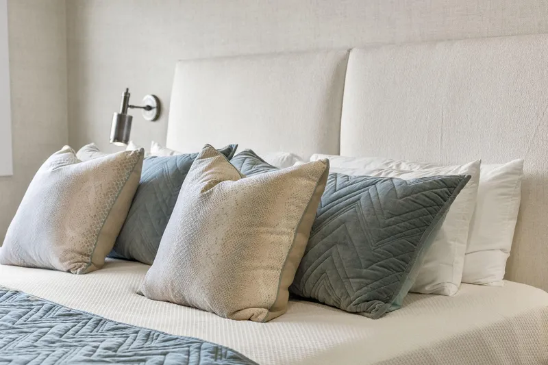 Shine Down Yacht Photos Pics Luxurious bed with elegant pillows and modern wall lamp, Breaux Brothers 120 GLV 2025.