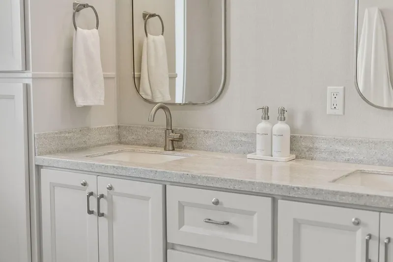 Shine Down Yacht Photos Pics Modern bathroom vanity with dual sinks, elegant mirrors, and sleek fixtures.