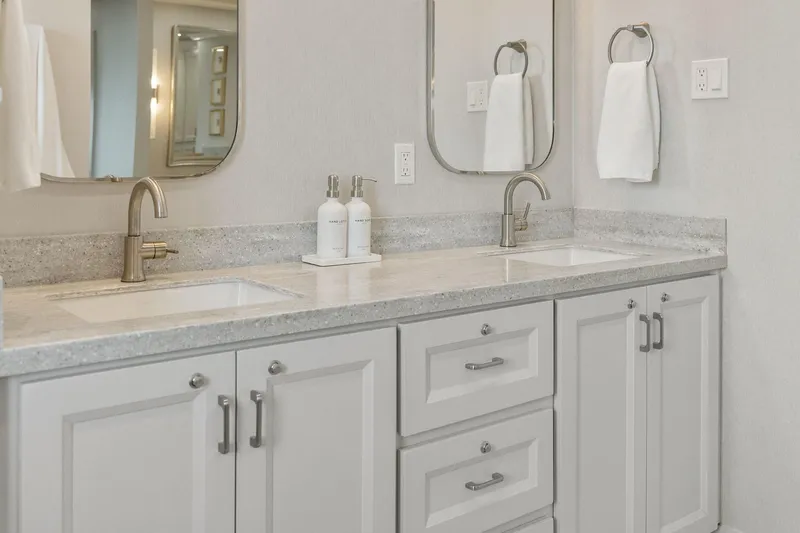 Shine Down Yacht Photos Pics Modern bathroom with dual sinks, elegant faucets, and sleek cabinetry.