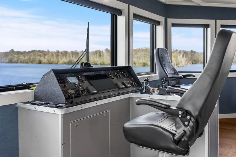 Shine Down Yacht Photos Pics Pilot cabin of 2025 Breaux Brothers 120 GLV with modern controls and scenic view.