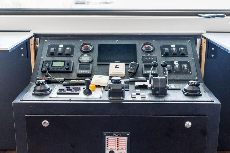 Shine Down Yacht Photos Pics Control panel of 2025 Breaux Brothers 120 GLV boat with various instruments and switches.