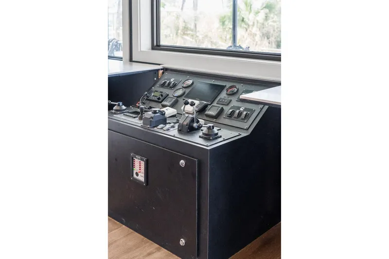 Shine Down Yacht Photos Pics Control panel of 2025 Breaux Brothers 120 GLV boat, featuring gauges and switches.