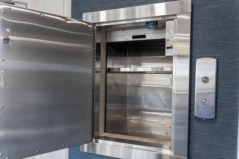 Shine Down Yacht Photos Pics Open stainless steel dumbwaiter, Breaux Brothers 120 GLV, 2025 model, with control panel.