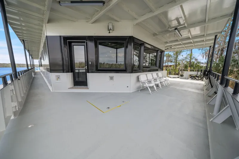 Shine Down Yacht Photos Pics Spacious deck of 2025 Breaux Brothers 120 GLV boat with seating and scenic views.