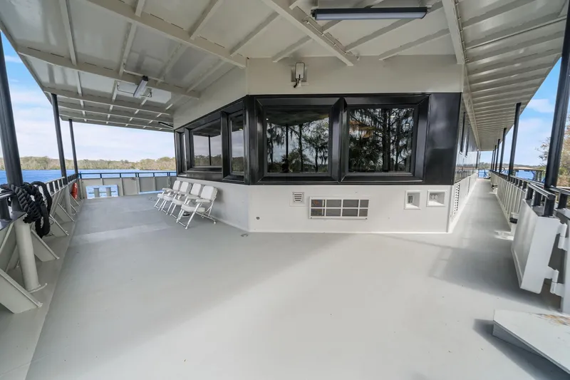 Shine Down Yacht Photos Pics Spacious deck of 2025 Breaux Brothers 120 GLV boat with seating and scenic views.