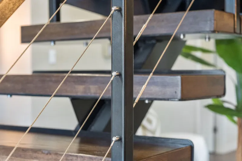 Shine Down Yacht Photos Pics Modern staircase with wooden steps and metal cable railing, Breaux Brothers 120 GLV, 2025 model.