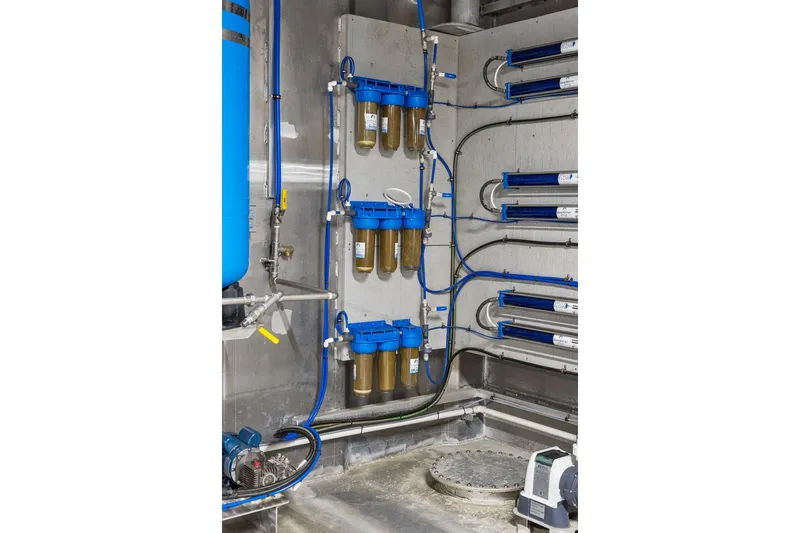 Shine Down Yacht Photos Pics Interior of Breaux Brothers 120 GLV 2025, showcasing advanced filtration system and piping.