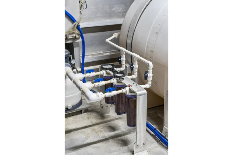 Shine Down Yacht Photos Pics Industrial piping system on Breaux Brothers 120 GLV, 2025 model, featuring multiple valves and filters.