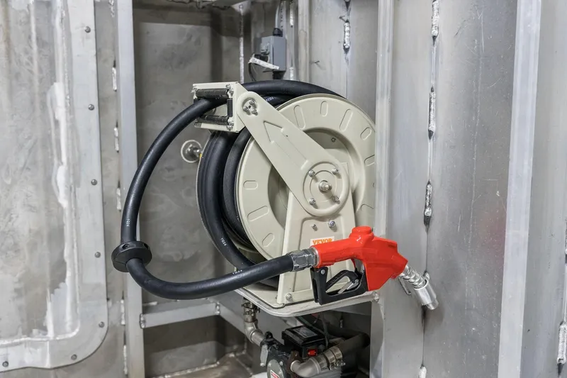 Shine Down Yacht Photos Pics Fuel hose reel with red nozzle on Breaux Brothers 120 GLV, 2025 model.