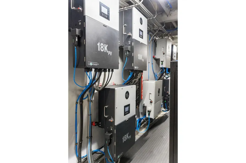 Shine Down Yacht Photos Pics Electrical control panels in a Breaux Brothers 120 GLV, 2025 model, with blue wiring.